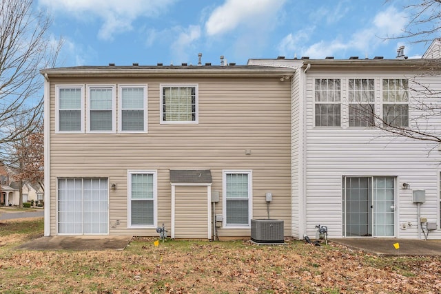 rear view of house with central air condition unit