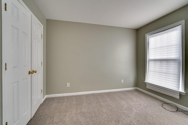 unfurnished bedroom with carpet