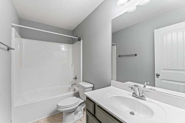 full bathroom with vanity, a textured ceiling, washtub / shower combination, and toilet