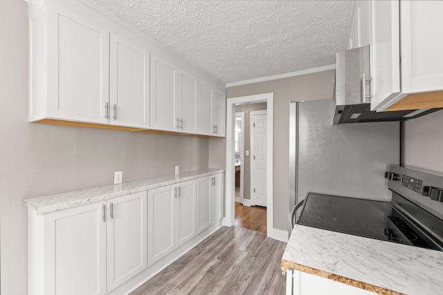 kitchen with light hardwood / wood-style flooring, crown molding, white cabinetry, and stainless steel range with electric stovetop