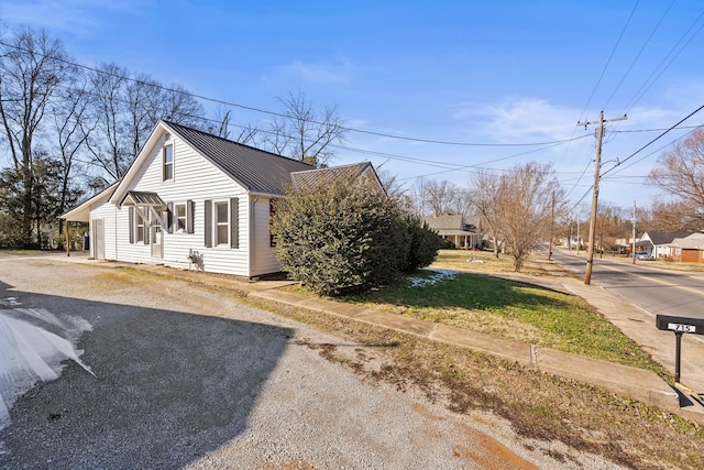 view of home's exterior with a yard