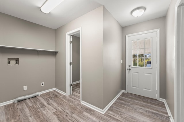 washroom featuring washer hookup, hookup for an electric dryer, and light hardwood / wood-style floors