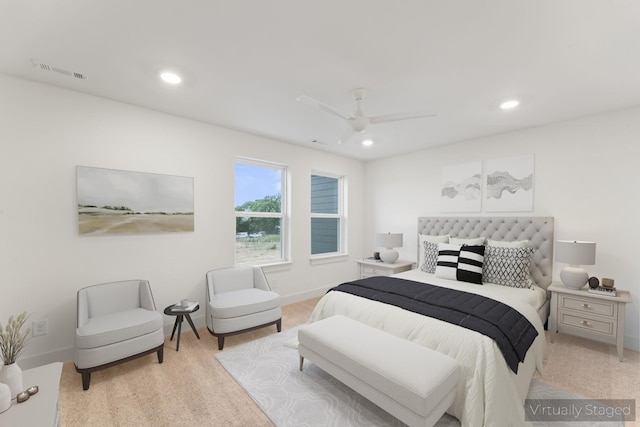 bedroom featuring light colored carpet and ceiling fan