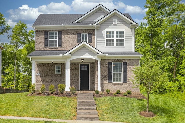 craftsman house featuring a front lawn