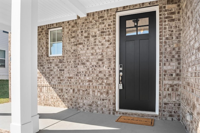 doorway to property featuring covered porch