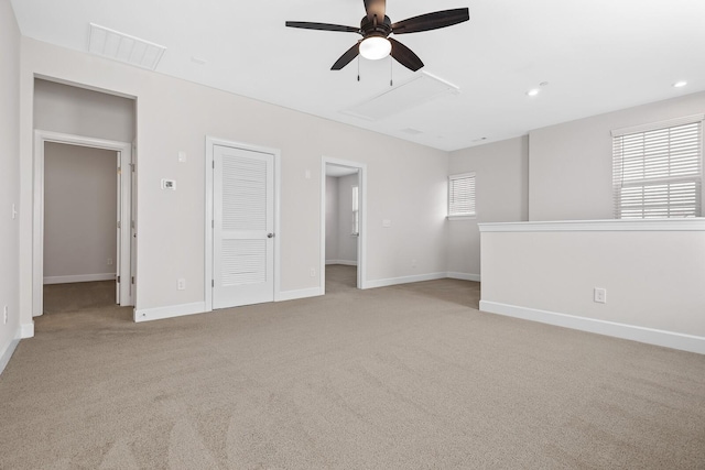 spare room with recessed lighting, visible vents, a ceiling fan, light carpet, and baseboards