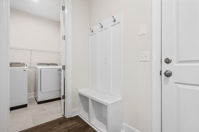 mudroom featuring washing machine and clothes dryer and wood finished floors