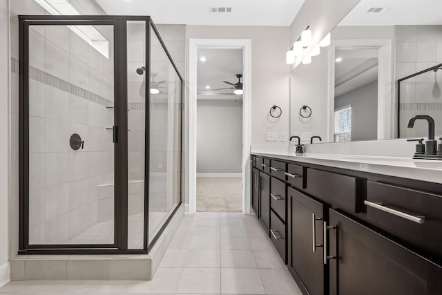 full bathroom featuring a stall shower, visible vents, and vanity