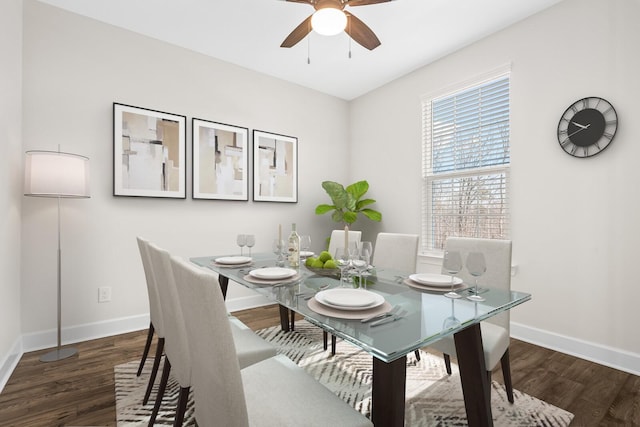 dining room featuring ceiling fan, baseboards, and wood finished floors