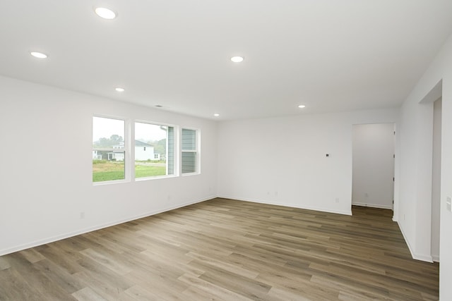 spare room with light wood-type flooring