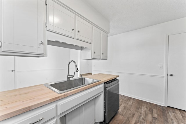 kitchen with a textured ceiling, dishwasher, white cabinetry, sink, and dark hardwood / wood-style floors