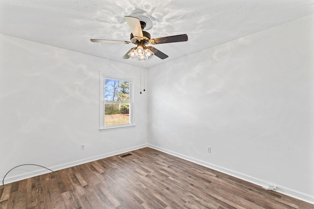 empty room with ceiling fan and hardwood / wood-style flooring