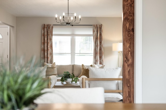 living area with a notable chandelier