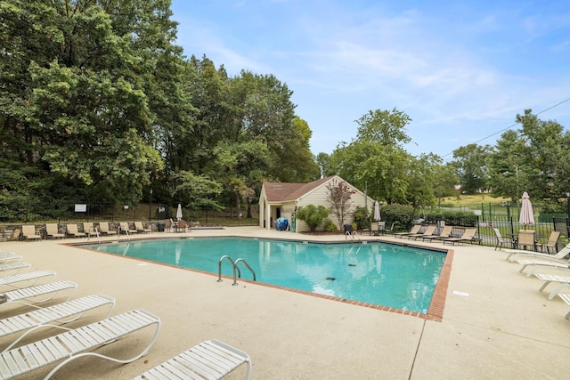 view of swimming pool featuring a patio area