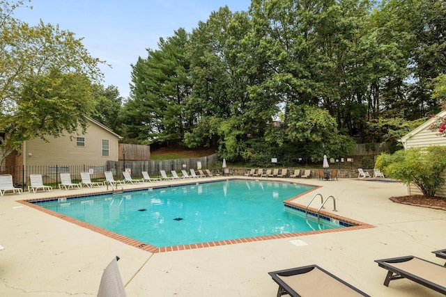 view of swimming pool with a patio