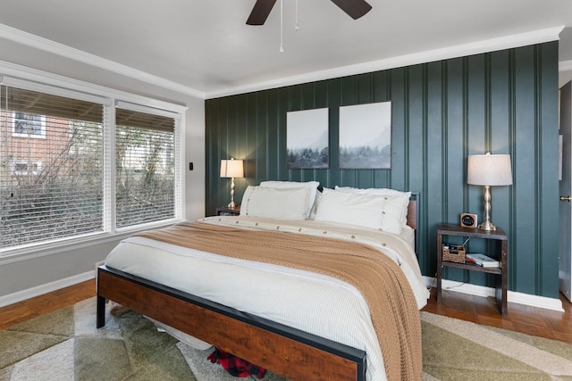 bedroom with ceiling fan and ornamental molding