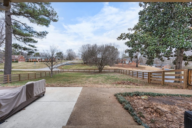 view of yard with a patio and a rural view