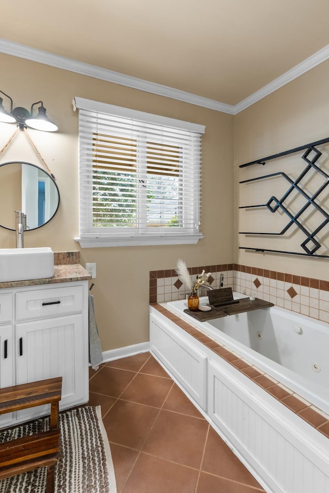 bathroom with tile patterned floors, vanity, a bathing tub, and ornamental molding