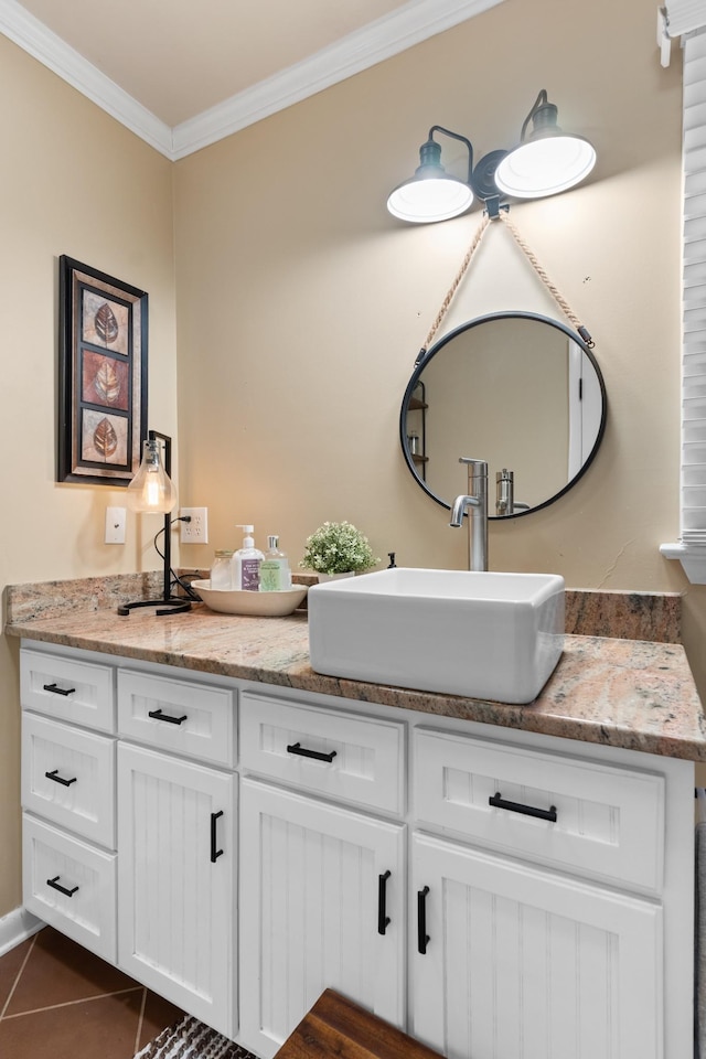 bathroom with tile patterned flooring, vanity, and ornamental molding