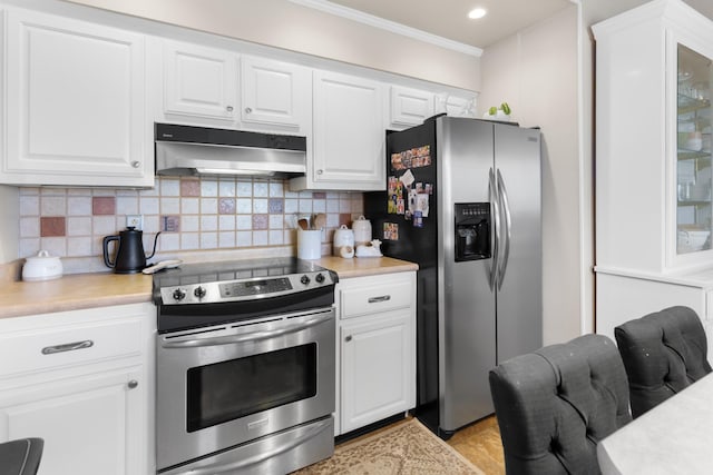 kitchen featuring white cabinetry, range hood, appliances with stainless steel finishes, and tasteful backsplash