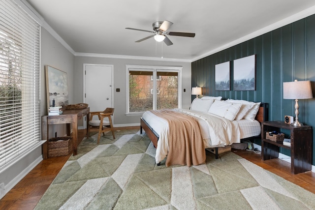 bedroom featuring ceiling fan, crown molding, and parquet flooring