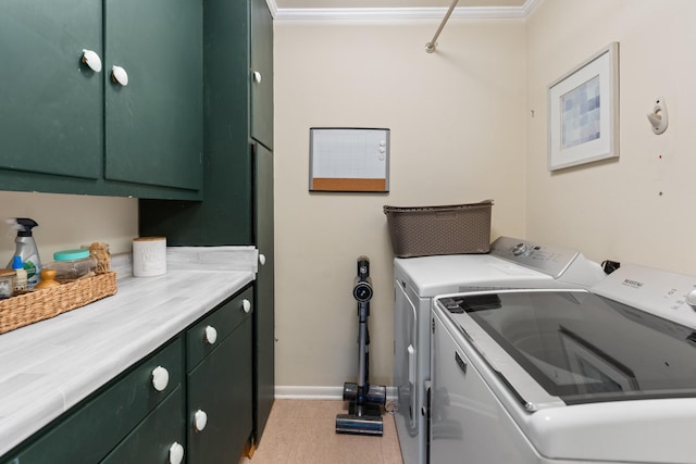 laundry area featuring cabinets, light wood-type flooring, washer and dryer, and ornamental molding