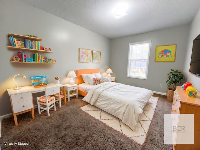 bedroom featuring carpet and baseboards