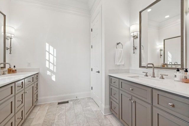 bathroom with vanity and ornamental molding