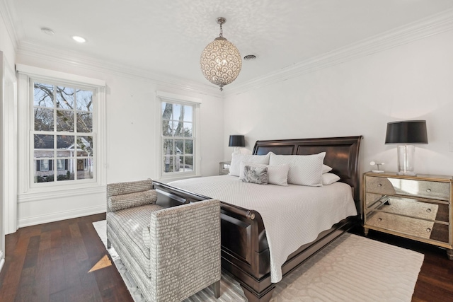 bedroom with dark hardwood / wood-style flooring, ornamental molding, and multiple windows