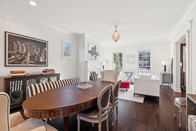 dining space with dark hardwood / wood-style floors and crown molding