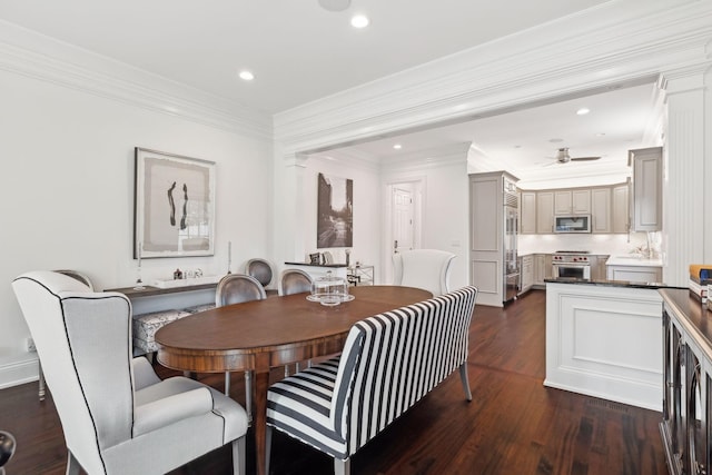 dining room with ceiling fan, dark hardwood / wood-style flooring, and ornamental molding