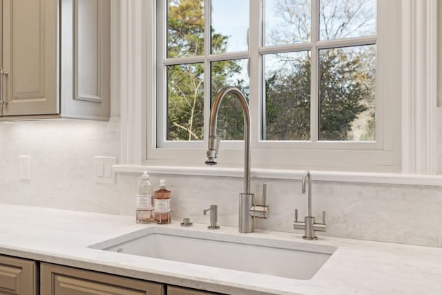 bar with sink and light stone counters