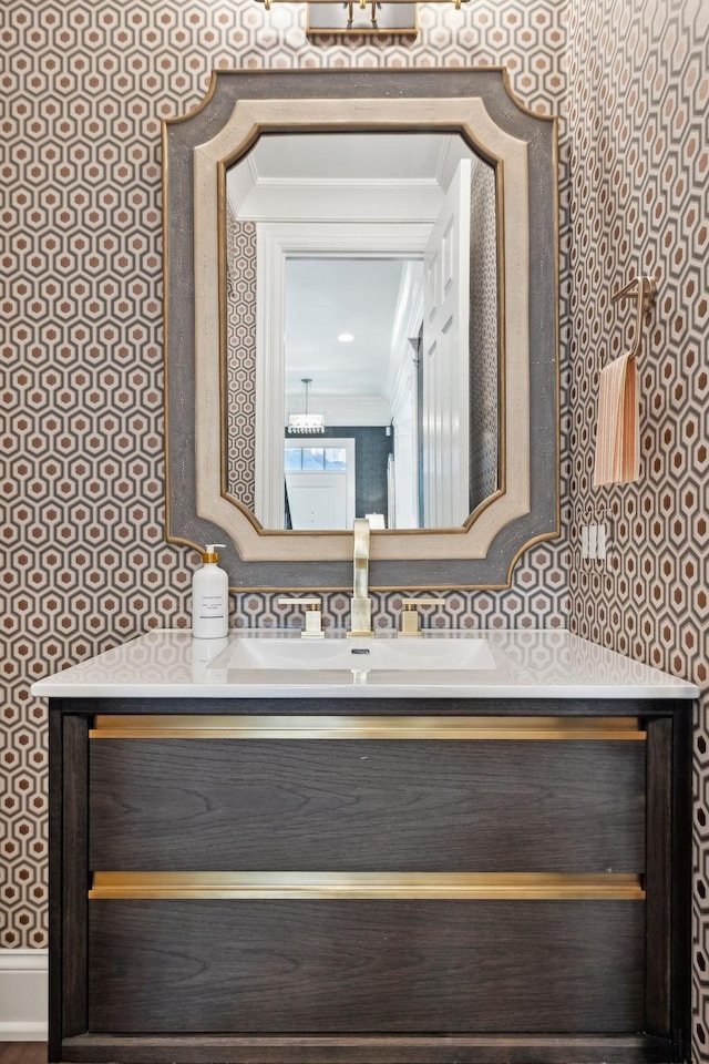 bathroom with vanity and crown molding