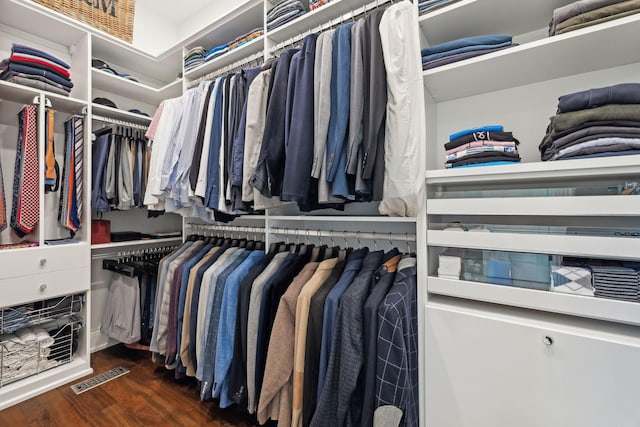 walk in closet featuring dark hardwood / wood-style floors