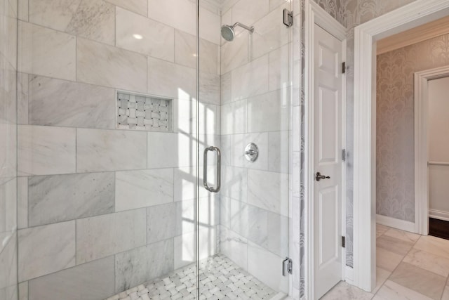 bathroom with a shower with shower door