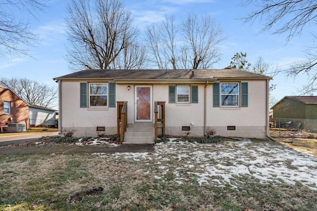 bungalow-style home with cooling unit