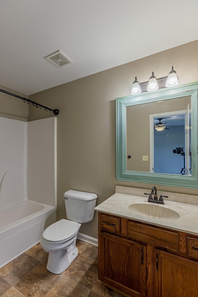 full bathroom featuring ceiling fan, toilet, vanity, and shower / washtub combination