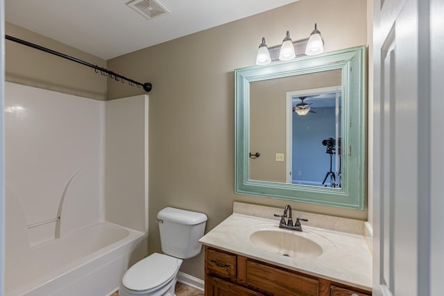 full bathroom featuring ceiling fan, vanity, toilet, and shower / washtub combination