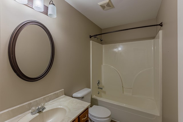 full bathroom featuring toilet, vanity, and bathtub / shower combination