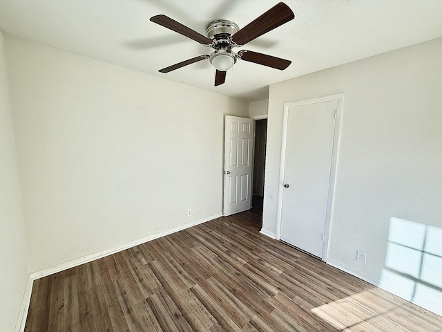 unfurnished bedroom featuring hardwood / wood-style floors and ceiling fan