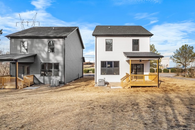 rear view of property featuring central AC unit