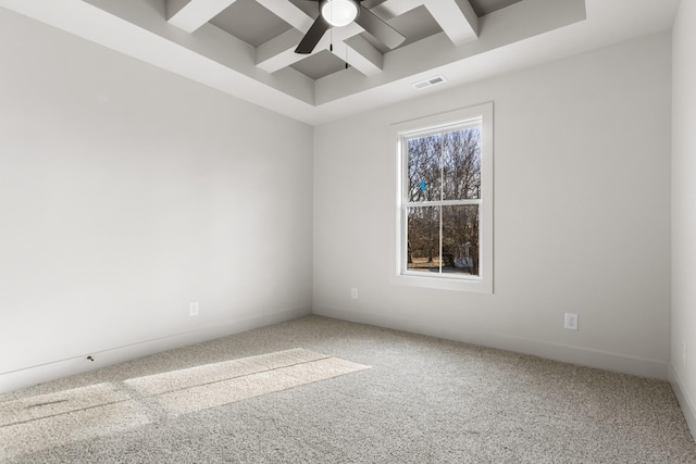 unfurnished room featuring ceiling fan, beam ceiling, carpet floors, and coffered ceiling