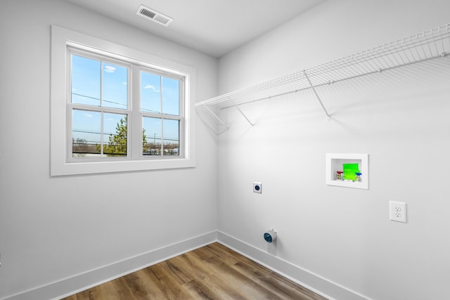 laundry area featuring washer hookup, wood-type flooring, and hookup for an electric dryer