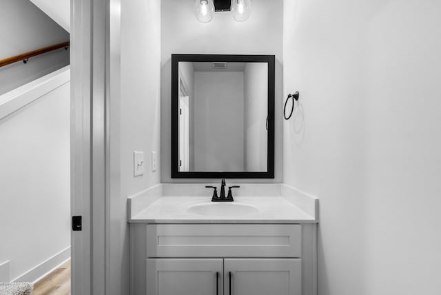 bathroom featuring hardwood / wood-style floors and vanity