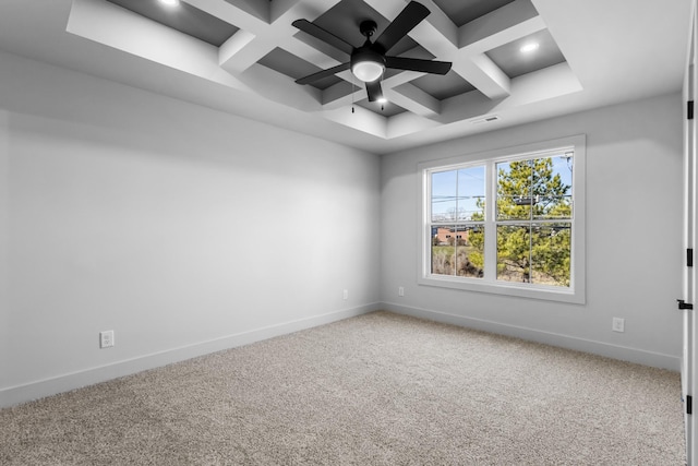 carpeted empty room featuring beamed ceiling and coffered ceiling