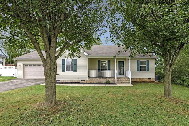 ranch-style house with a porch, a garage, and a front yard