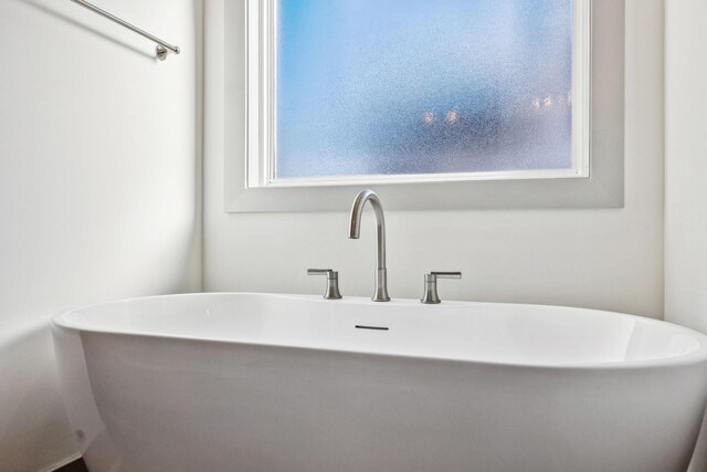 bathroom with a tub