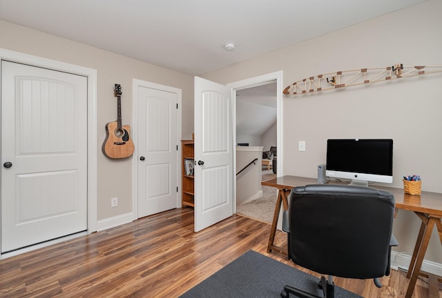 home office with dark wood-type flooring