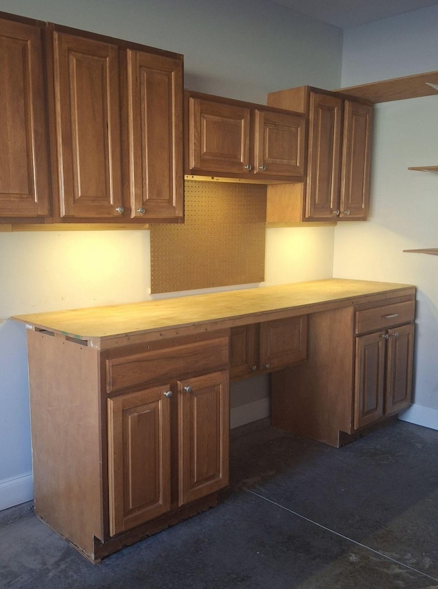 kitchen with built in desk and butcher block counters