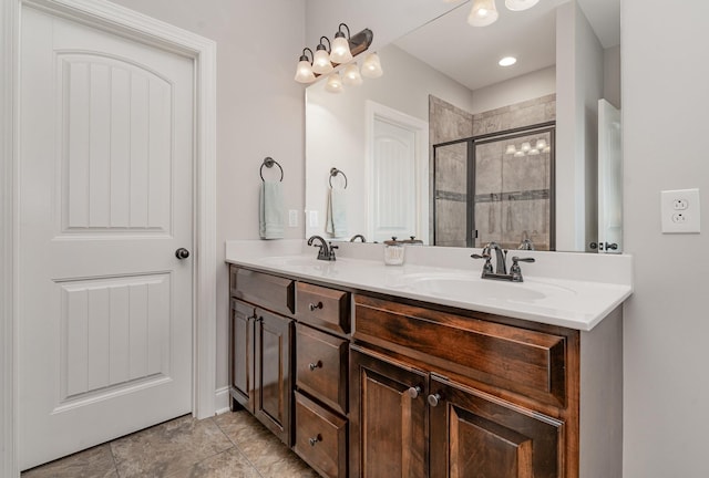 bathroom featuring vanity and a shower with shower door